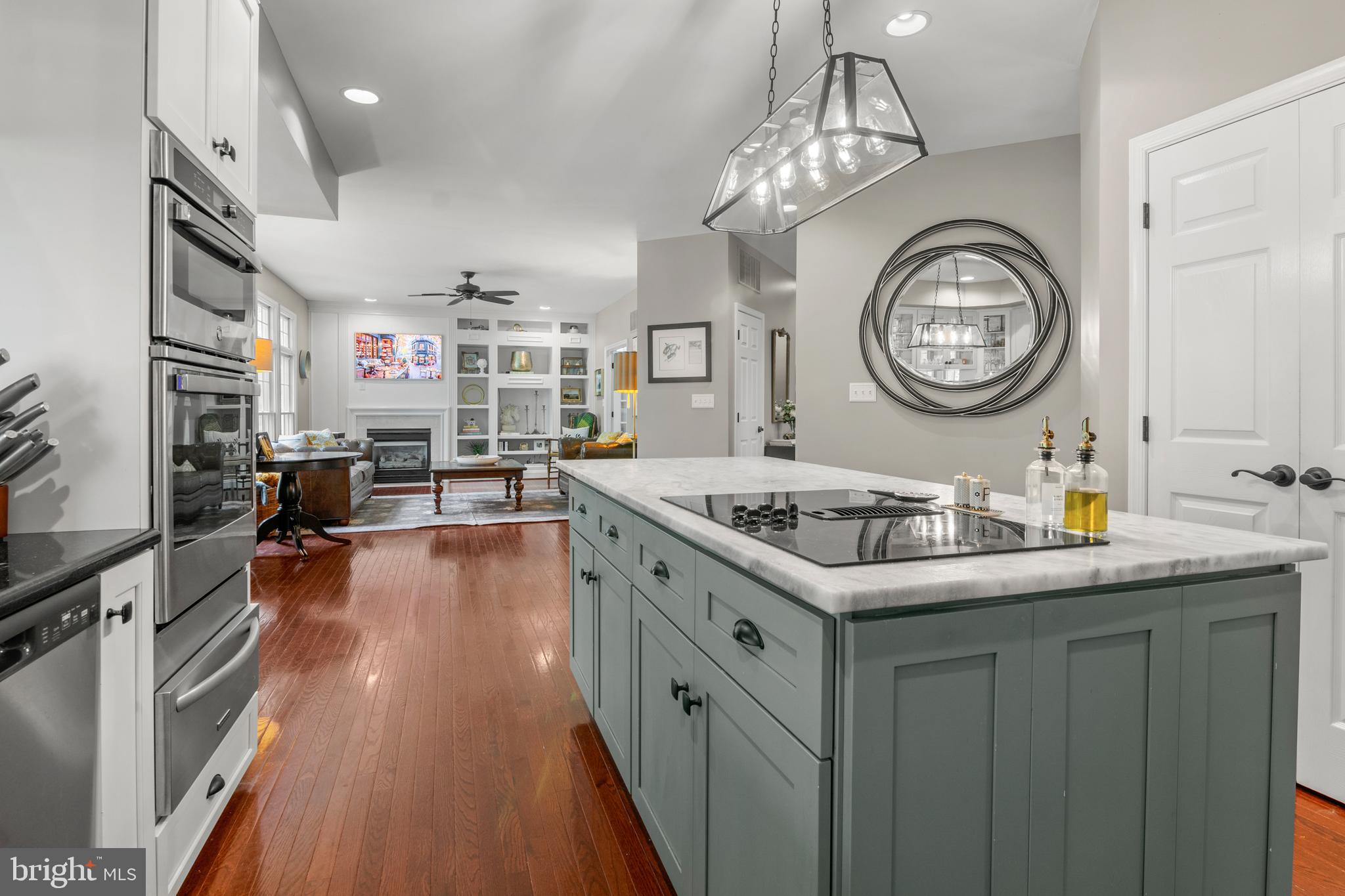 8504 Summershade Drive Odenton, MD 21113 - Photo 17 of 92 a kitchen with a stove and a clock on the wall