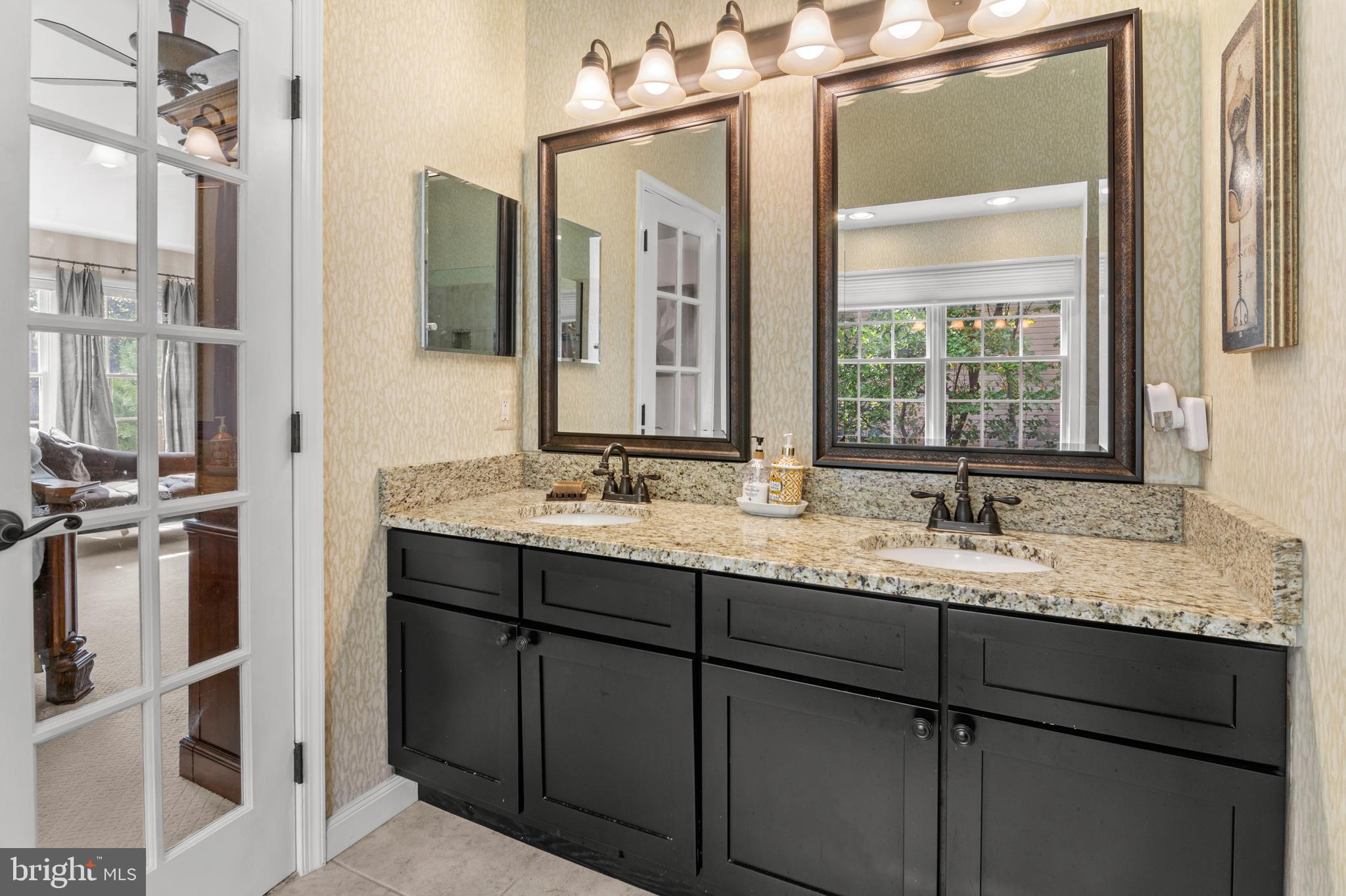 8504 Summershade Drive Odenton, MD 21113 - Photo 42 of 92 a bathroom with a granite countertop sink and a mirror