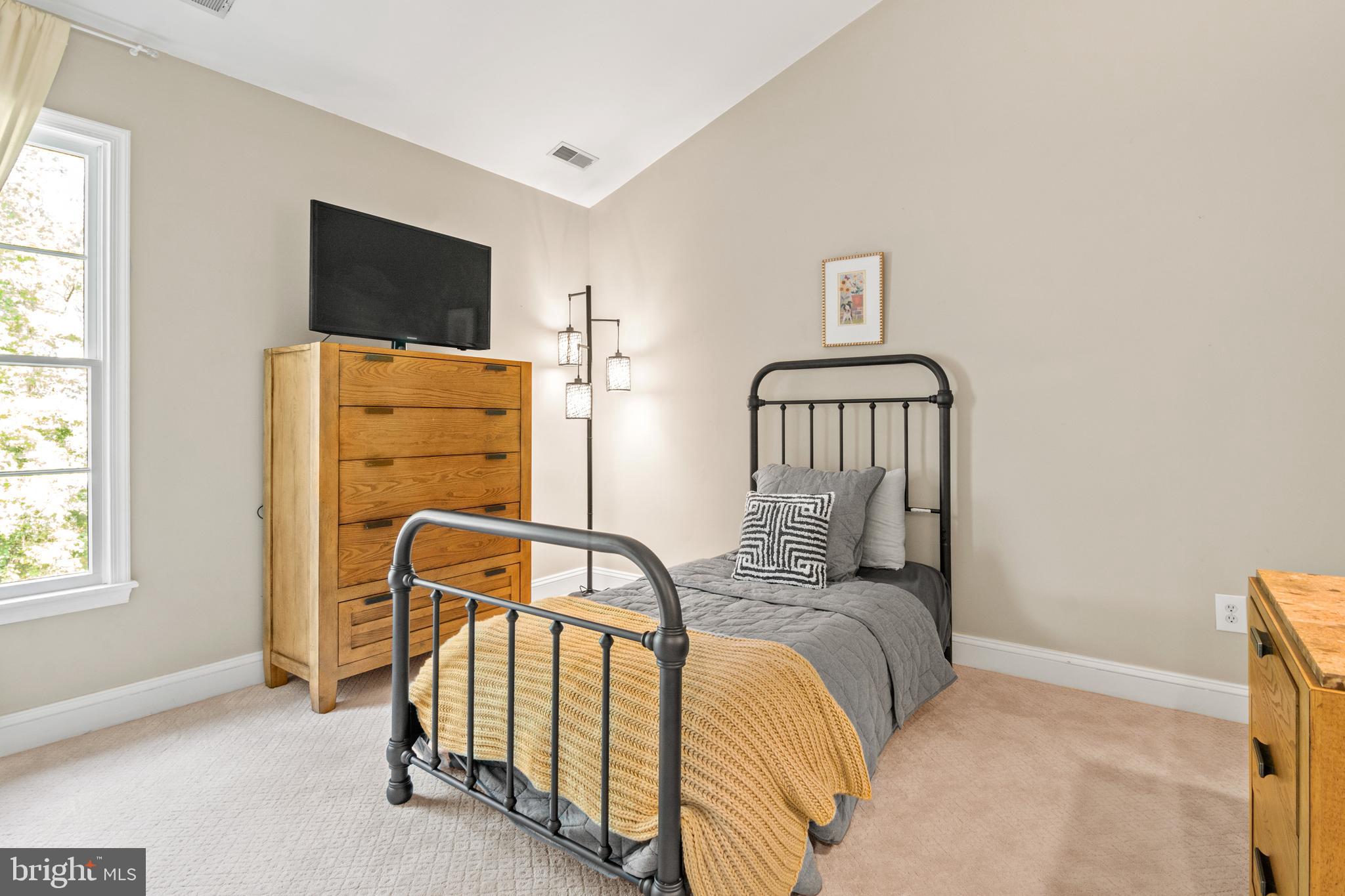 8504 Summershade Drive Odenton, MD 21113 - Photo 49 of 92 a bedroom with furniture and flat screen tv