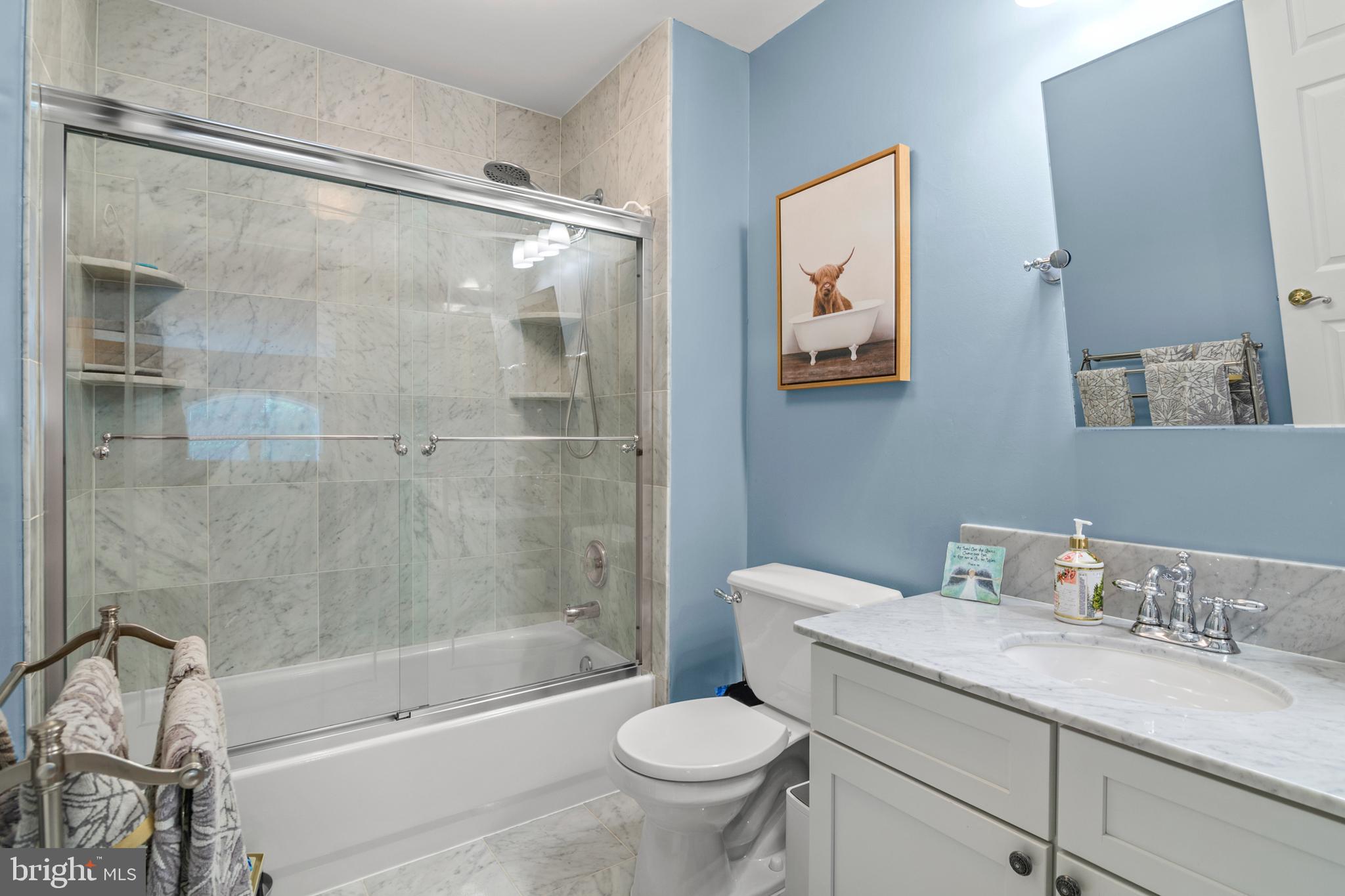 8504 Summershade Drive Odenton, MD 21113 - Photo 52 of 92 a bathroom with a granite countertop sink toilet and shower