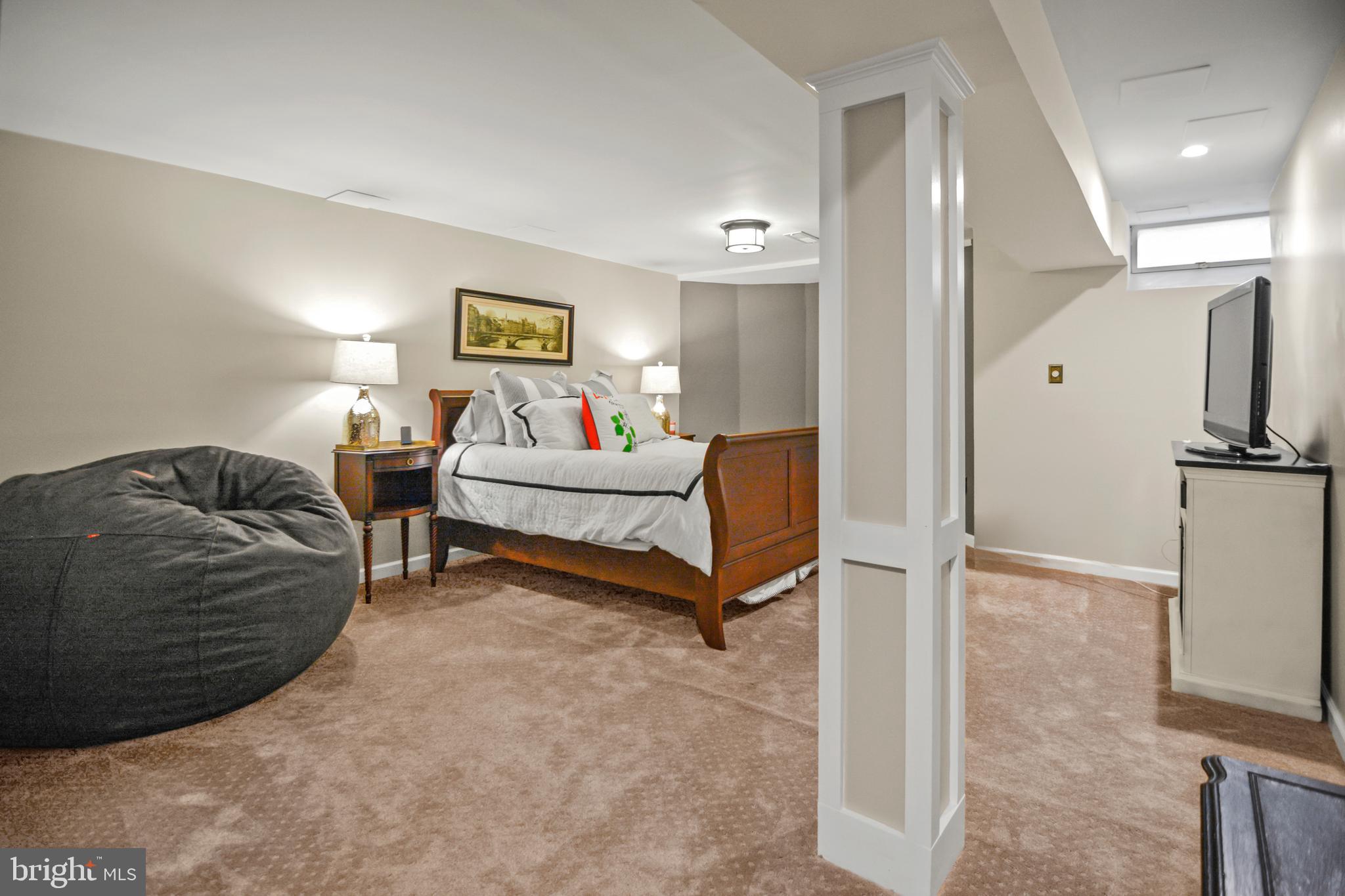 8504 Summershade Drive Odenton, MD 21113 - Photo 62 of 92 a living room with furniture a lamp and a rug