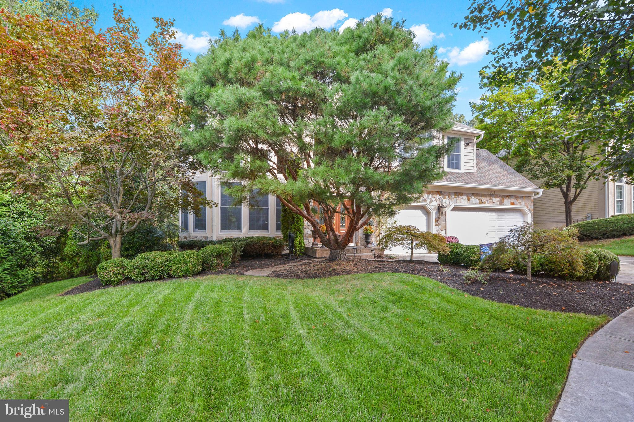 8504 Summershade Drive Odenton, MD 21113 - Photo 77 of 92 a front view of a house with a yard and trees