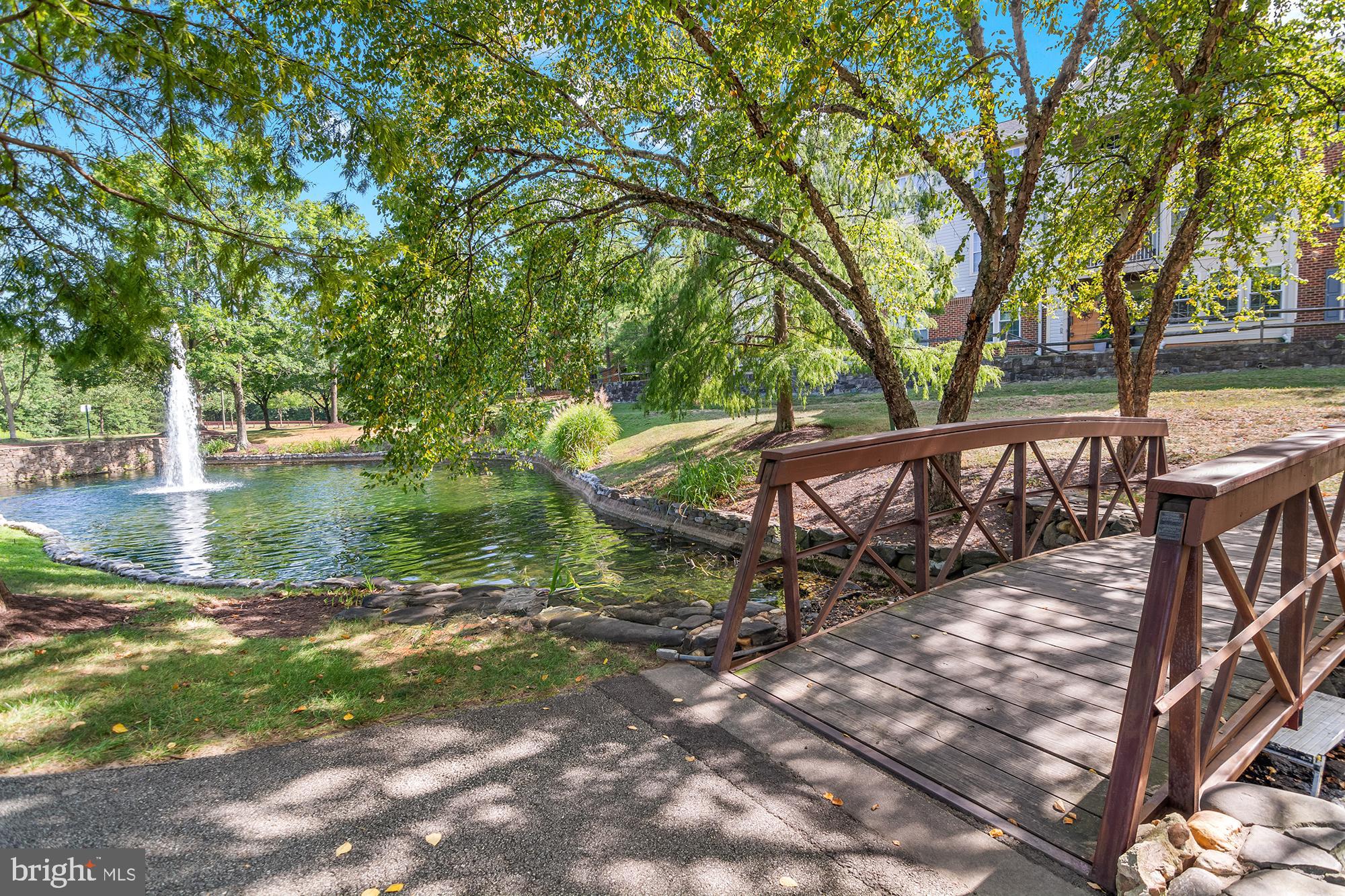 8504 Summershade Drive Odenton, MD 21113 - Photo 84 of 92 a view of a wooden deck with trees and wooden fence