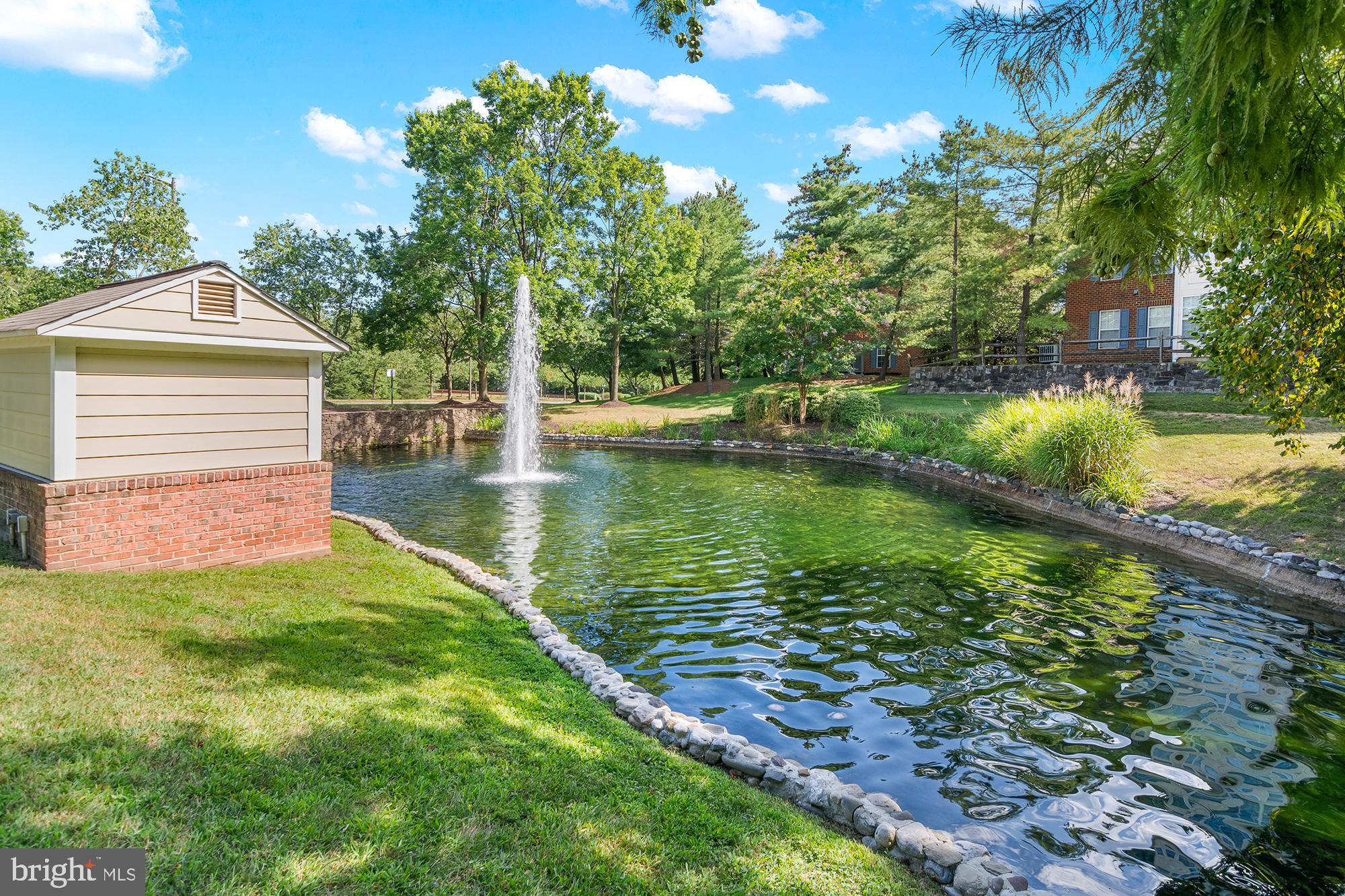 8504 Summershade Drive Odenton, MD 21113 - Photo 85 of 92 a view of a lake with a yard and potted plants