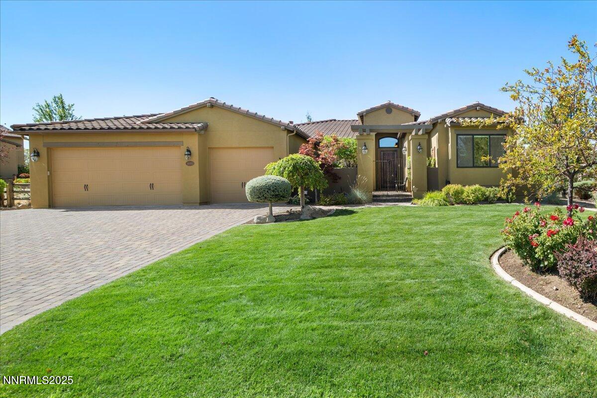 3880 Boulder Patch Reno, NV 89511 - Photo 3 of 53 a front view of a house with a yard and garage