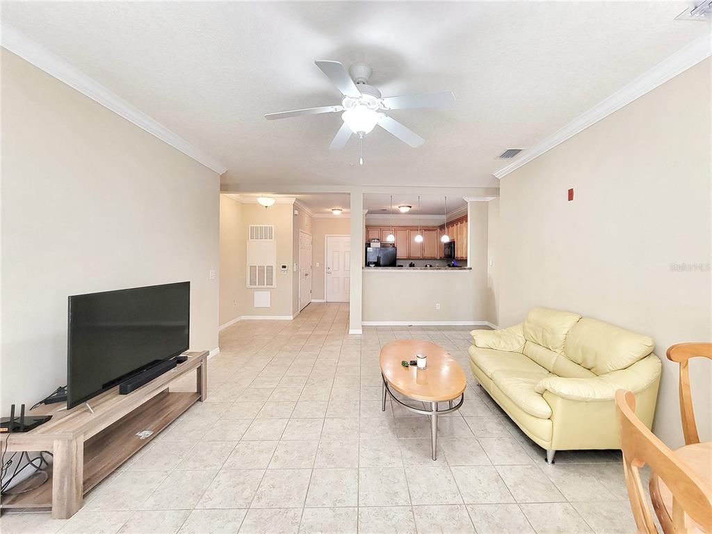 1185 Southwest 9th Road, Unit 306 Gainesville, FL 32601 - Photo 12 of 30 a living room with furniture and a flat screen tv