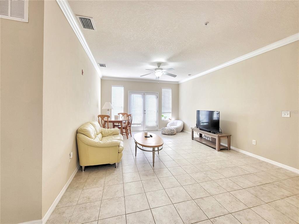 1185 Southwest 9th Road, Unit 306 Gainesville, FL 32601 - Photo 13 of 30 a living room with furniture a table and a potted plant