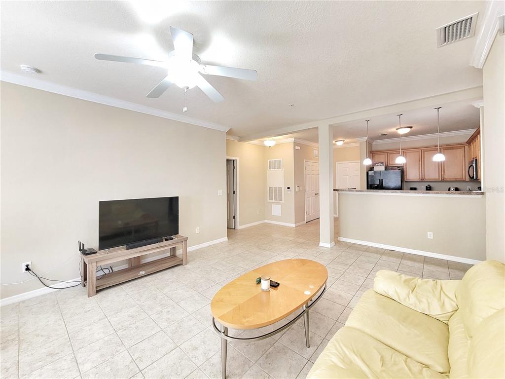 1185 Southwest 9th Road, Unit 306 Gainesville, FL 32601 - Photo 16 of 30 a living room with furniture and a flat screen tv