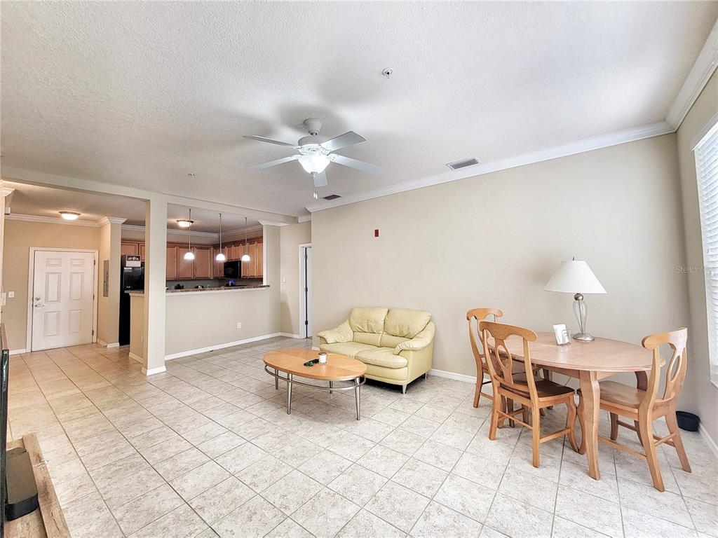 1185 Southwest 9th Road, Unit 306 Gainesville, FL 32601 - Photo 17 of 30 a view of a dining room with furniture