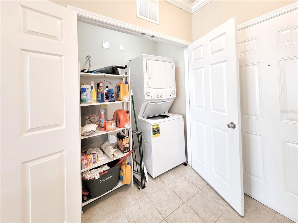 1185 Southwest 9th Road, Unit 306 Gainesville, FL 32601 - Photo 9 of 30 a view of utility room with closet and racks