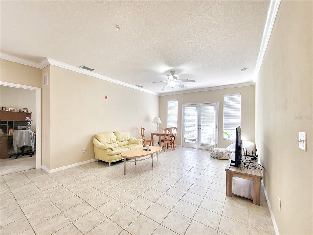 1185 Southwest 9th Road, Unit 306 Gainesville, FL 32601 - Photo 10 of 30 a living room with furniture and wooden floor