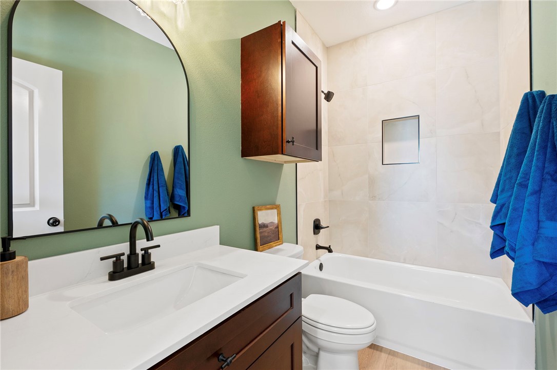 104 33rd Street West Bryan, TX 77803 - Photo 11 of 13 a bathroom with a sink and a mirror
