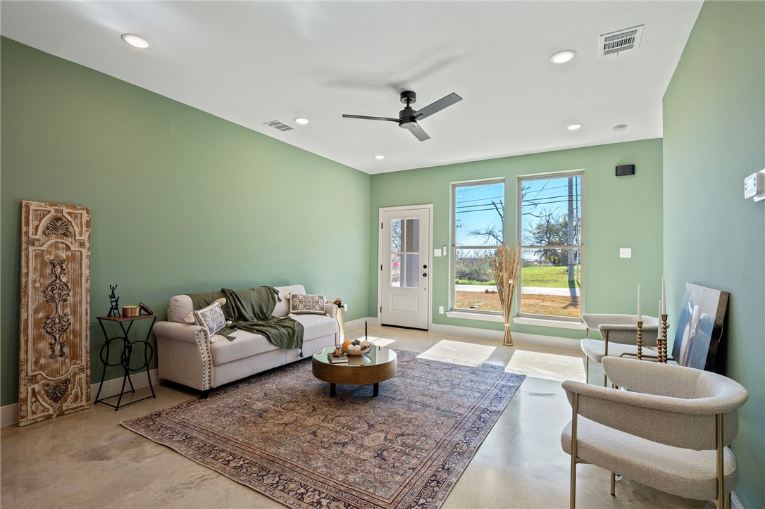 104 33rd Street West Bryan, TX 77803 - Photo 3 of 13 a living room with furniture and a large window