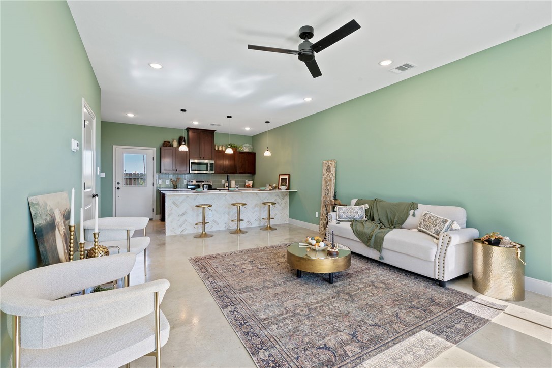 104 33rd Street West Bryan, TX 77803 - Photo 4 of 13 a living room with furniture and kitchen view