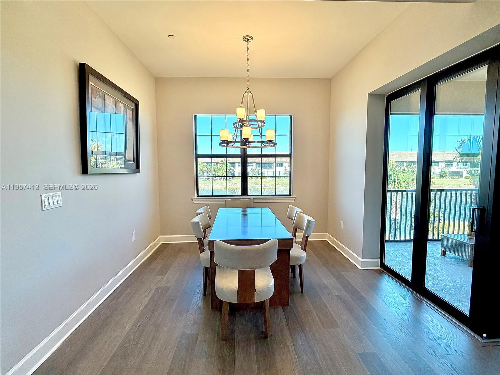 15323 Lucerna Street, Unit 204 Naples, FL 34114 - Photo 8 of 29 a dining room with furniture window and wooden floor