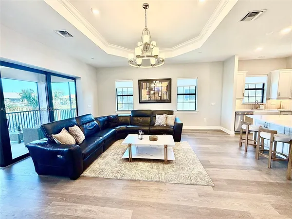 a living room with furniture rug and window