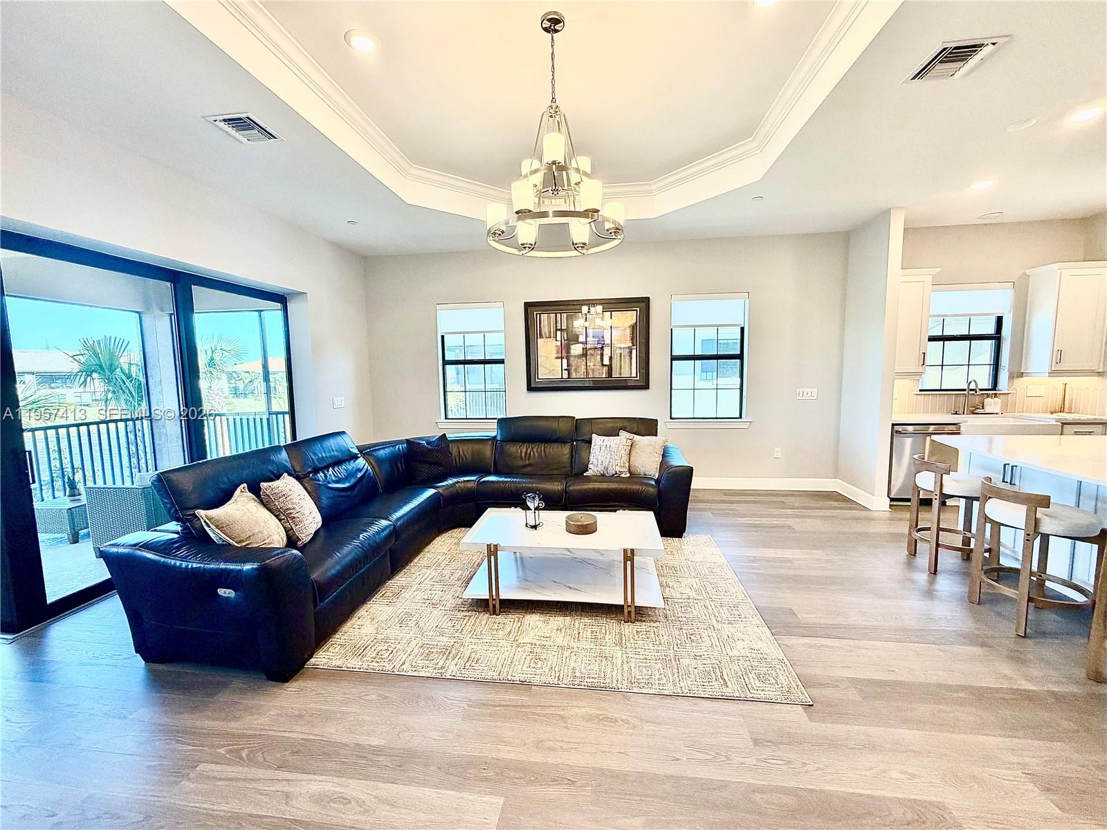 15323 Lucerna Street, Unit 204 Naples, FL 34114 - Photo 10 of 29 a living room with furniture rug and window