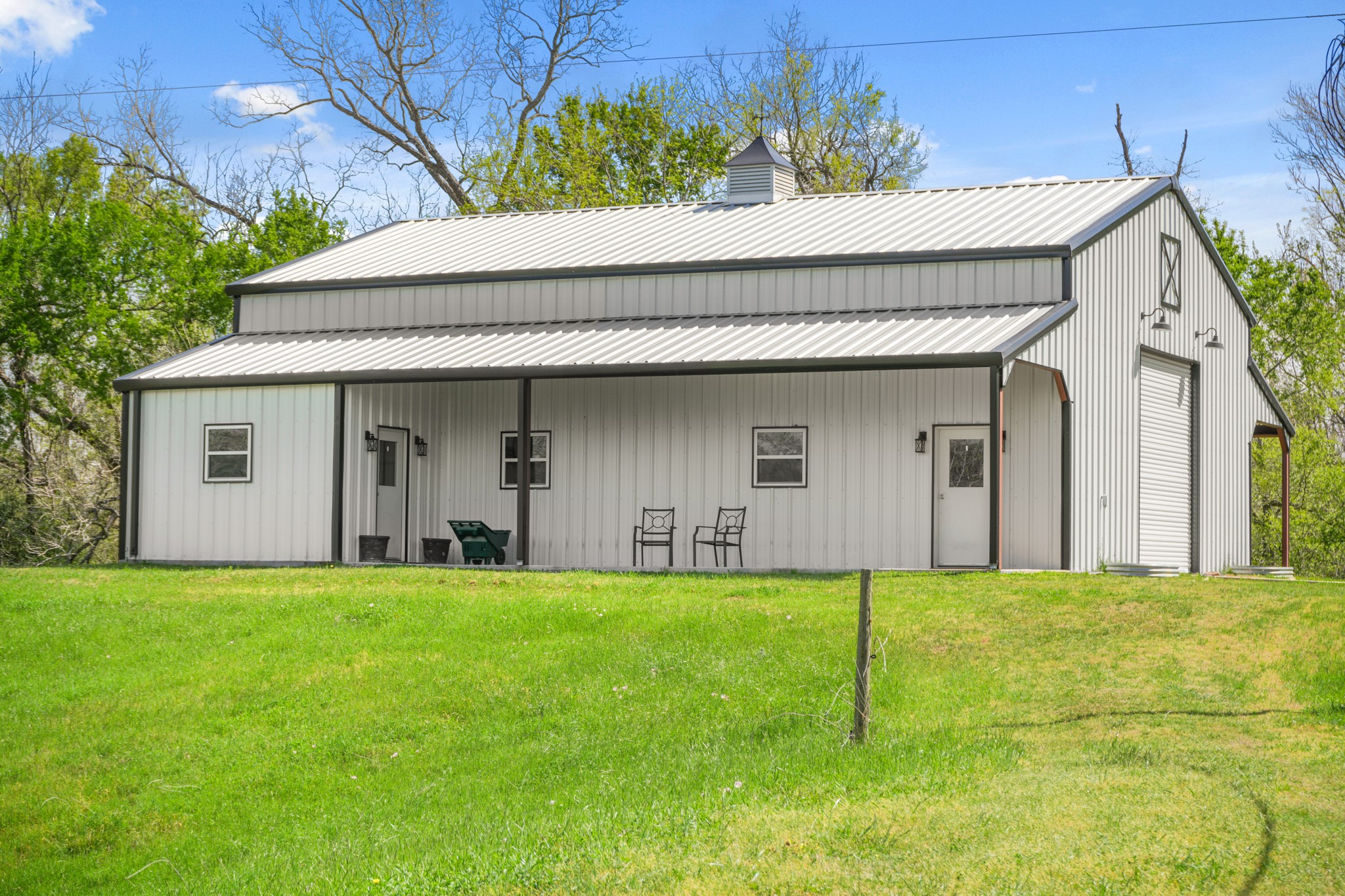 41712 Harpers Church Road Hempstead, TX 77445 - Photo 44 of 50 36x50 Barn w/metal roof and sunset views, w 10 ft porch area, 2 roll up doors and additional 10 ft lean-to
