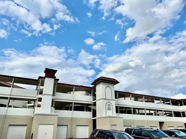 a front view of a building with lot of windows