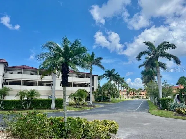 a front view of house with yard and swimming pool