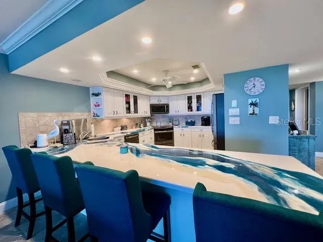 a large kitchen with a table and chairs