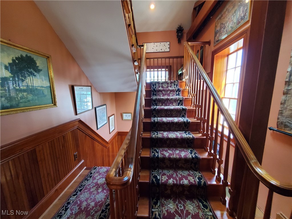 150 Main Street Hayesville, OH 44805 - Photo 18 of 50 Stairway with plenty of natural light and a wainscoted wall.