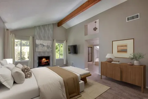 a view of empty room with a fireplace