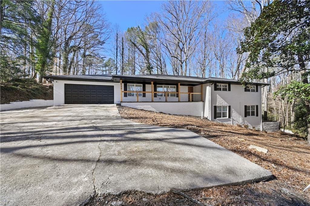 693 Peyton Road Southwest Atlanta, GA 30311 - Photo 1 of 1 a view of a house with a patio