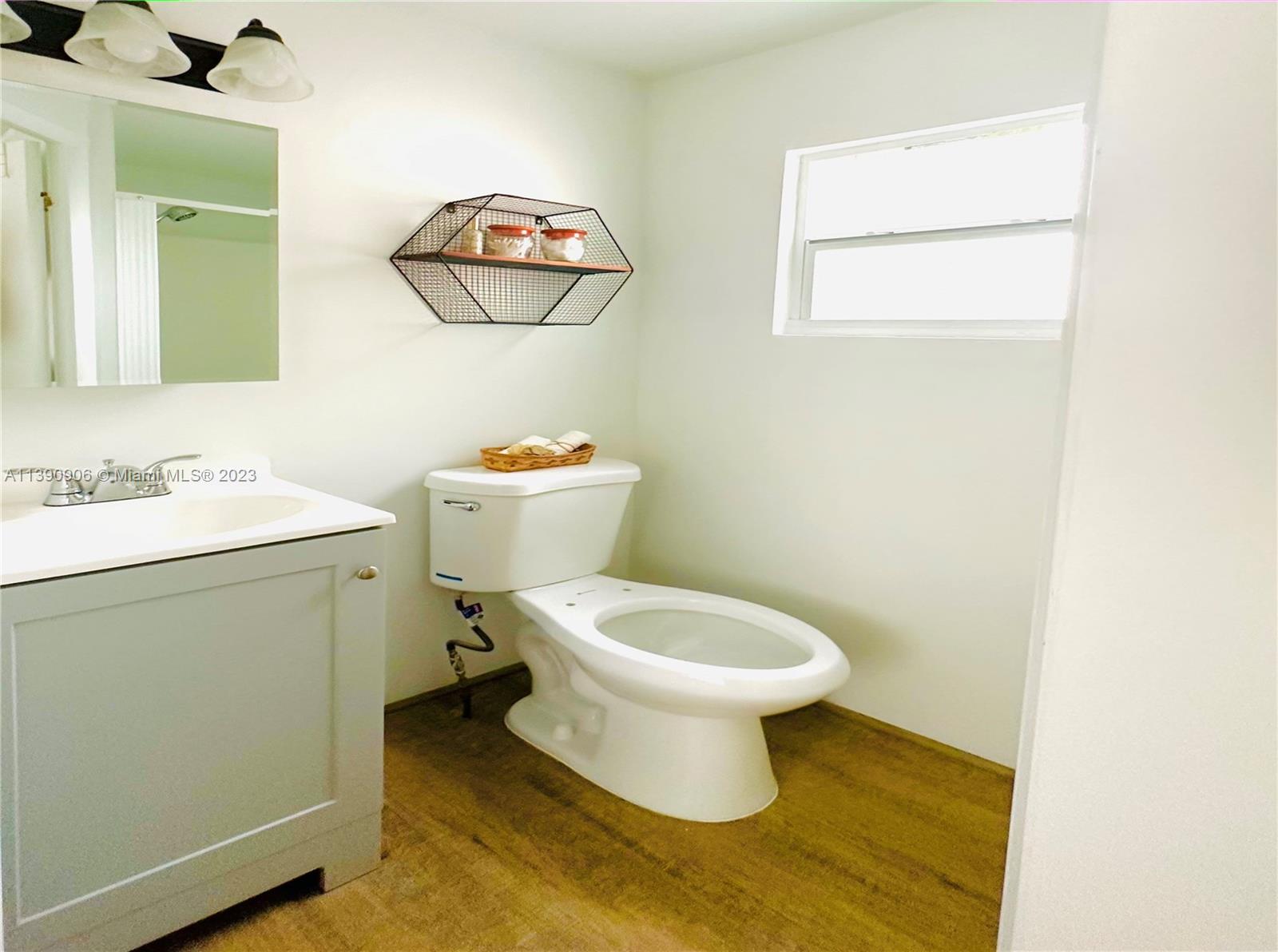 451 Southeast 8th Street Homestead, FL 33030 - Photo 6 of 10 a white toilet sitting next to a bathroom sink