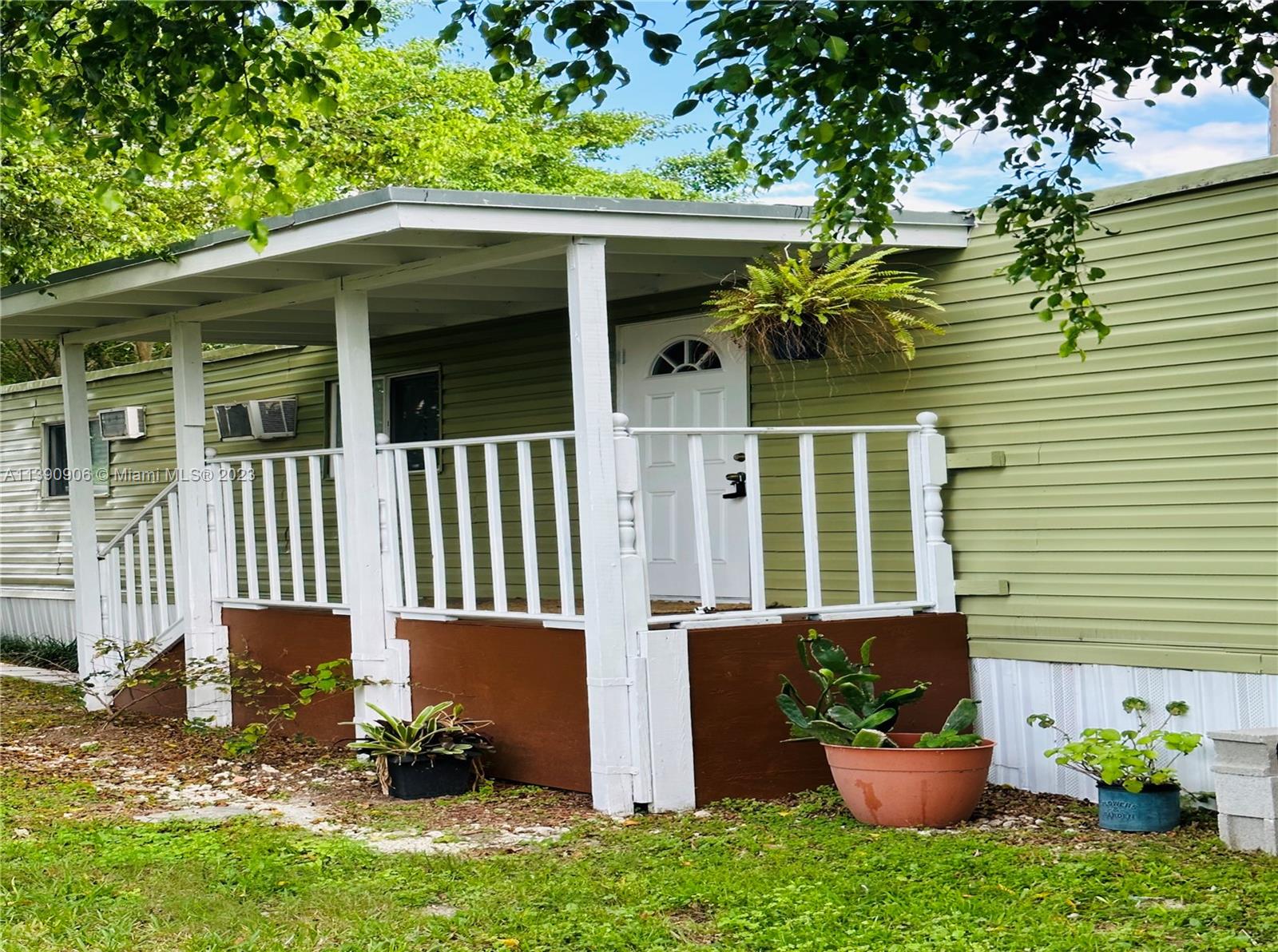 451 Southeast 8th Street Homestead, FL 33030 - Photo 10 of 10 a view of a house with a yard and a garden