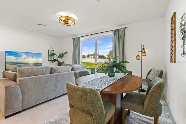 a living room with furniture and a table