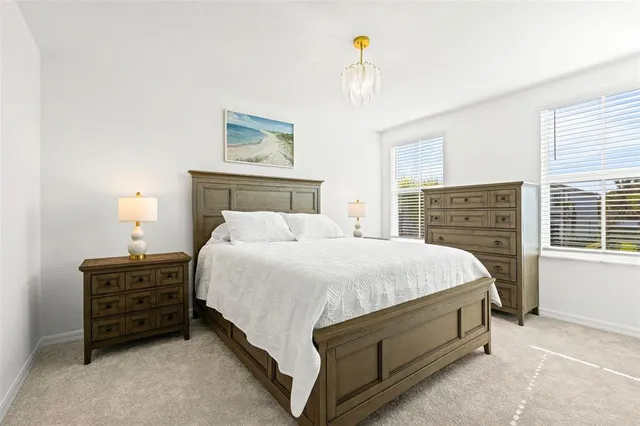 a bed room with a bed and a window