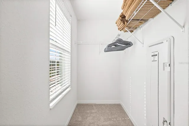 a view of an empty room and a window