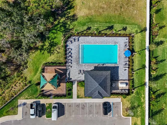 an aerial view of a house with a garden