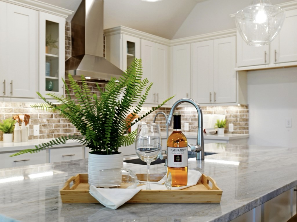 109 Lake Spring Circle Georgetown, TX 78633 - Photo 19 of 38 A well-lit kitchen island offers generous counter space for culinary endeavors and casual dining.
