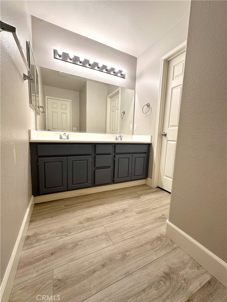 33878 Channel Street Temecula, CA 92592 - Photo 12 of 14 a large bathroom with a sink and a large mirror