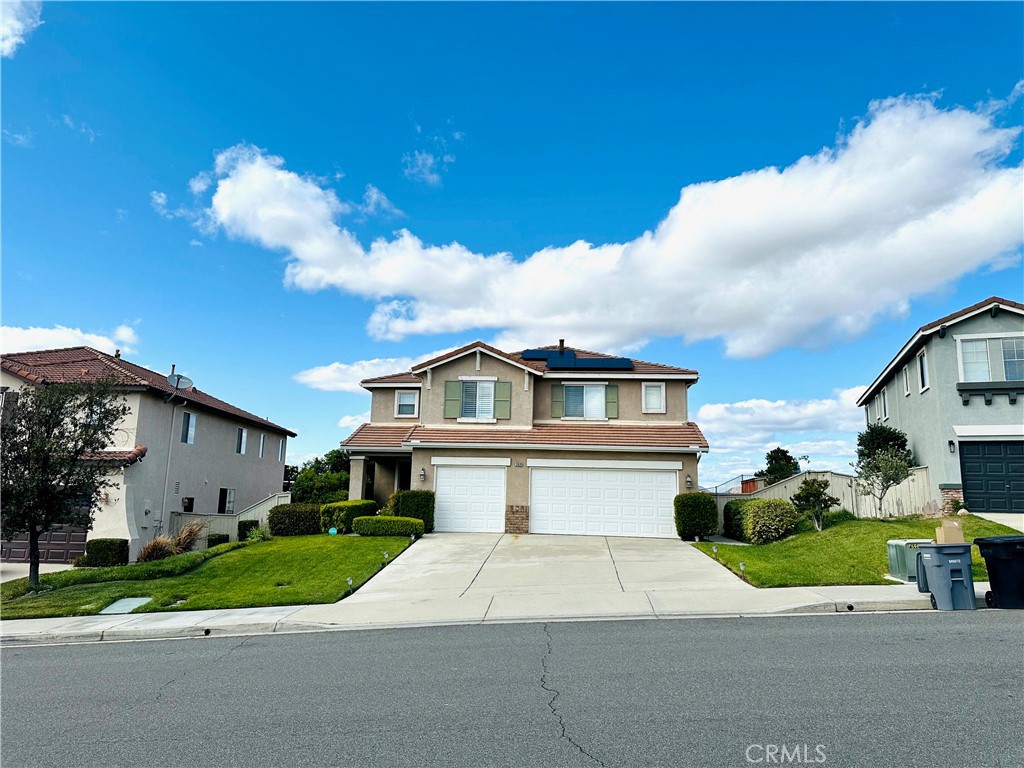 33878 Channel Street Temecula, CA 92592 - Photo 2 of 14 a front view of a house with a yard and garage