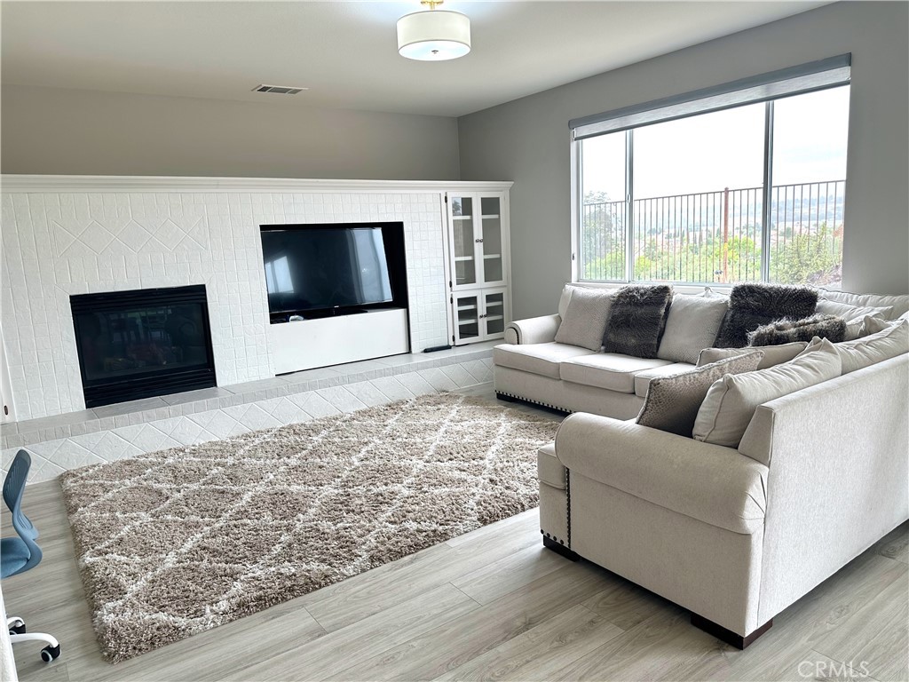 33878 Channel Street Temecula, CA 92592 - Photo 5 of 14 a living room with furniture and a flat screen tv