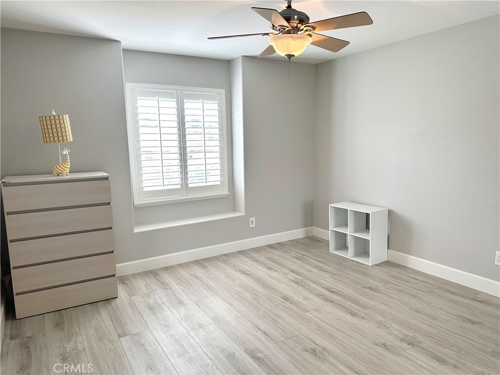 33878 Channel Street Temecula, CA 92592 - Photo 9 of 14 wooden floor in an empty room with a window