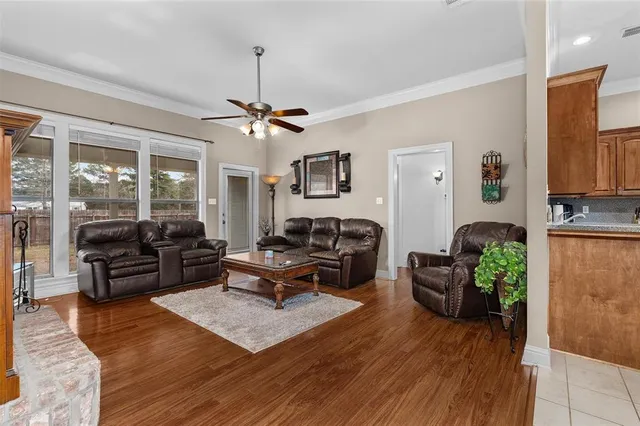 a living room with furniture or couch and a chandelier