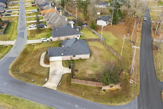 a view of a house with a backyard and a tub