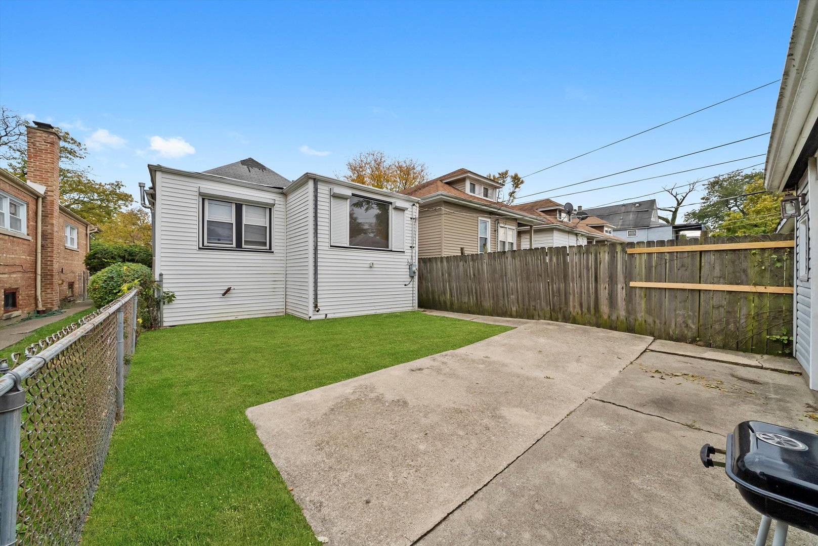 8808 South Loomis Street Chicago, IL 60620 - Photo 24 of 32 a view of a house with backyard and garden
