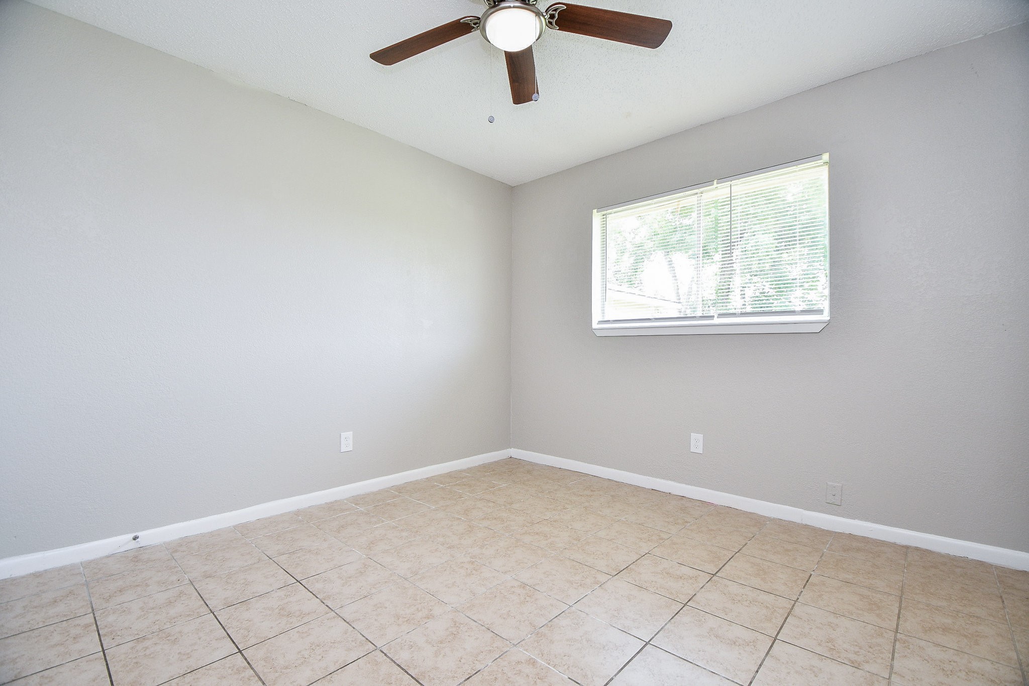 14902 Gloster Street Channelview, TX 77530 - Photo 12 of 21 a view of an empty room with window