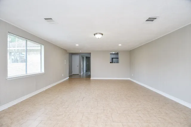 a view of an empty room with a window