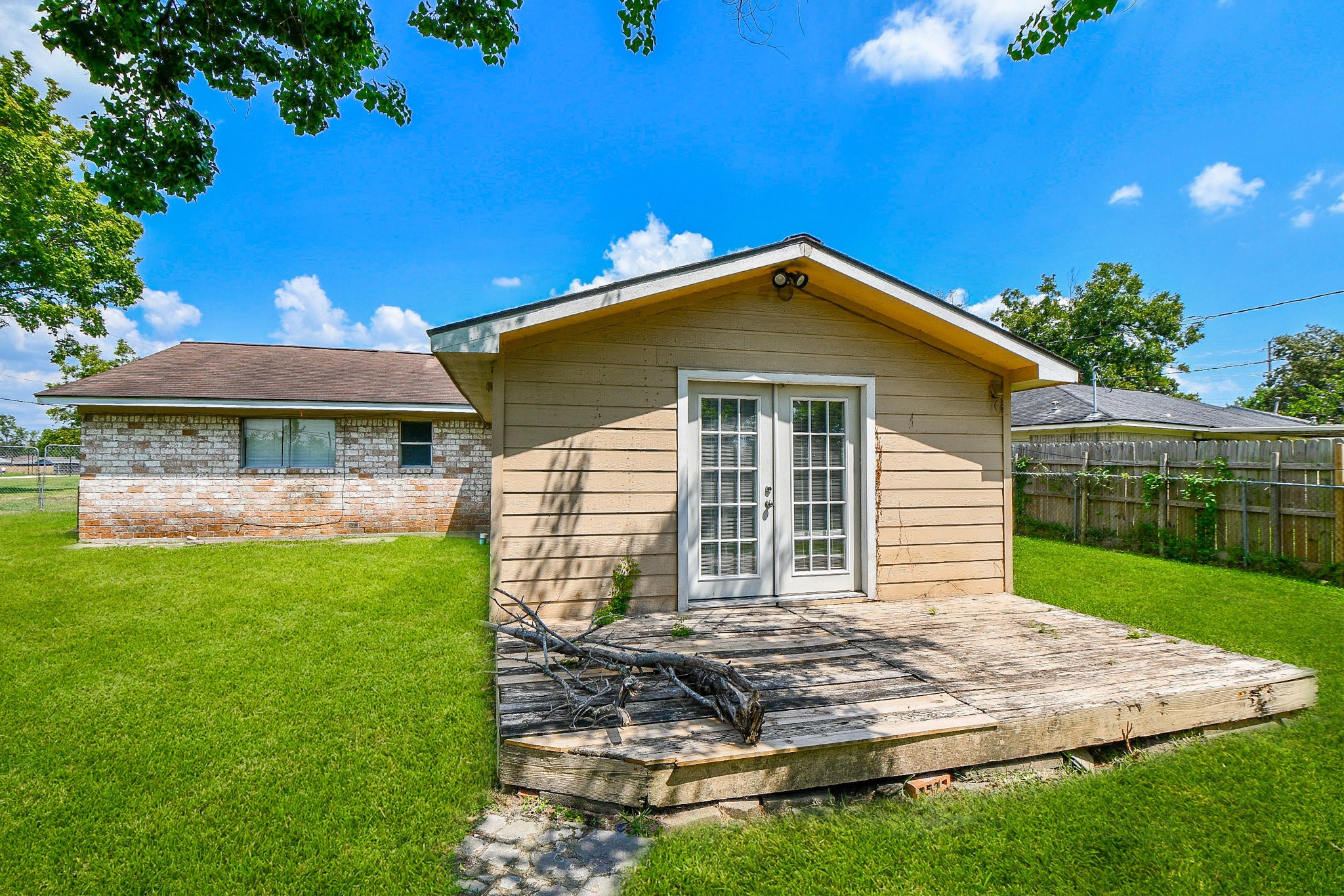 14902 Gloster Street Channelview, TX 77530 - Photo 17 of 21 a front view of a house with garden