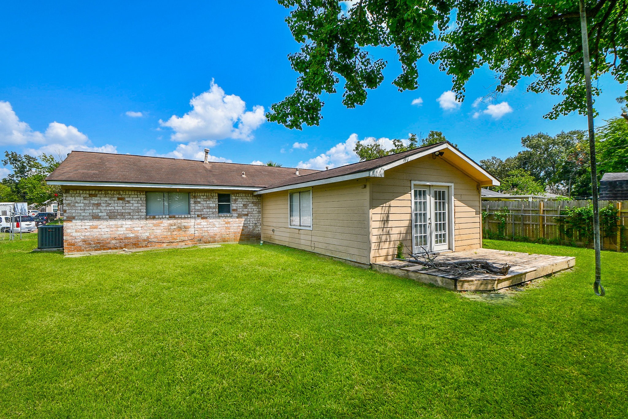 14902 Gloster Street Channelview, TX 77530 - Photo 19 of 21 a front view of a house with a garden