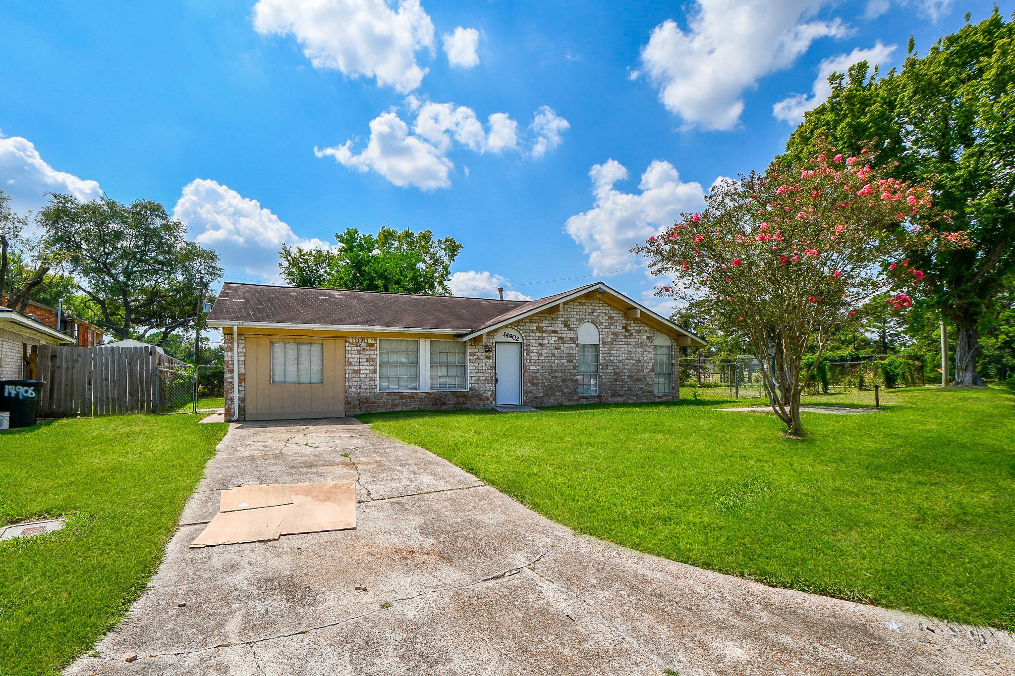 14902 Gloster Street Channelview, TX 77530 - Photo 2 of 21 a front view of a house with garden