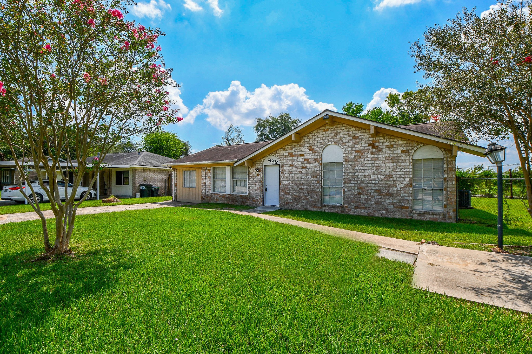 14902 Gloster Street Channelview, TX 77530 - Photo 21 of 21 a front view of a house with garden