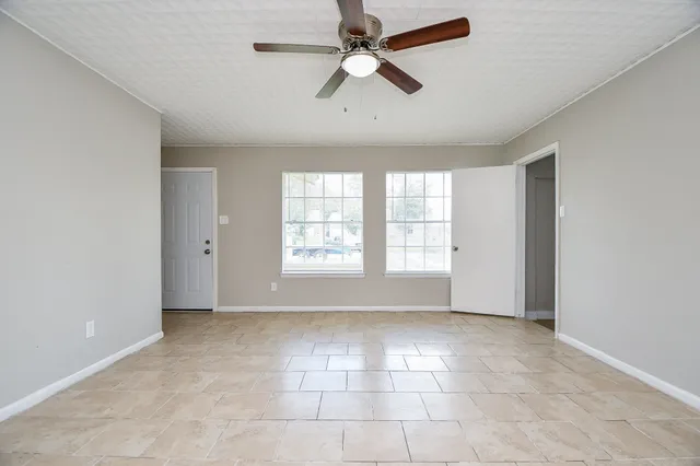 a view of an empty room with a window