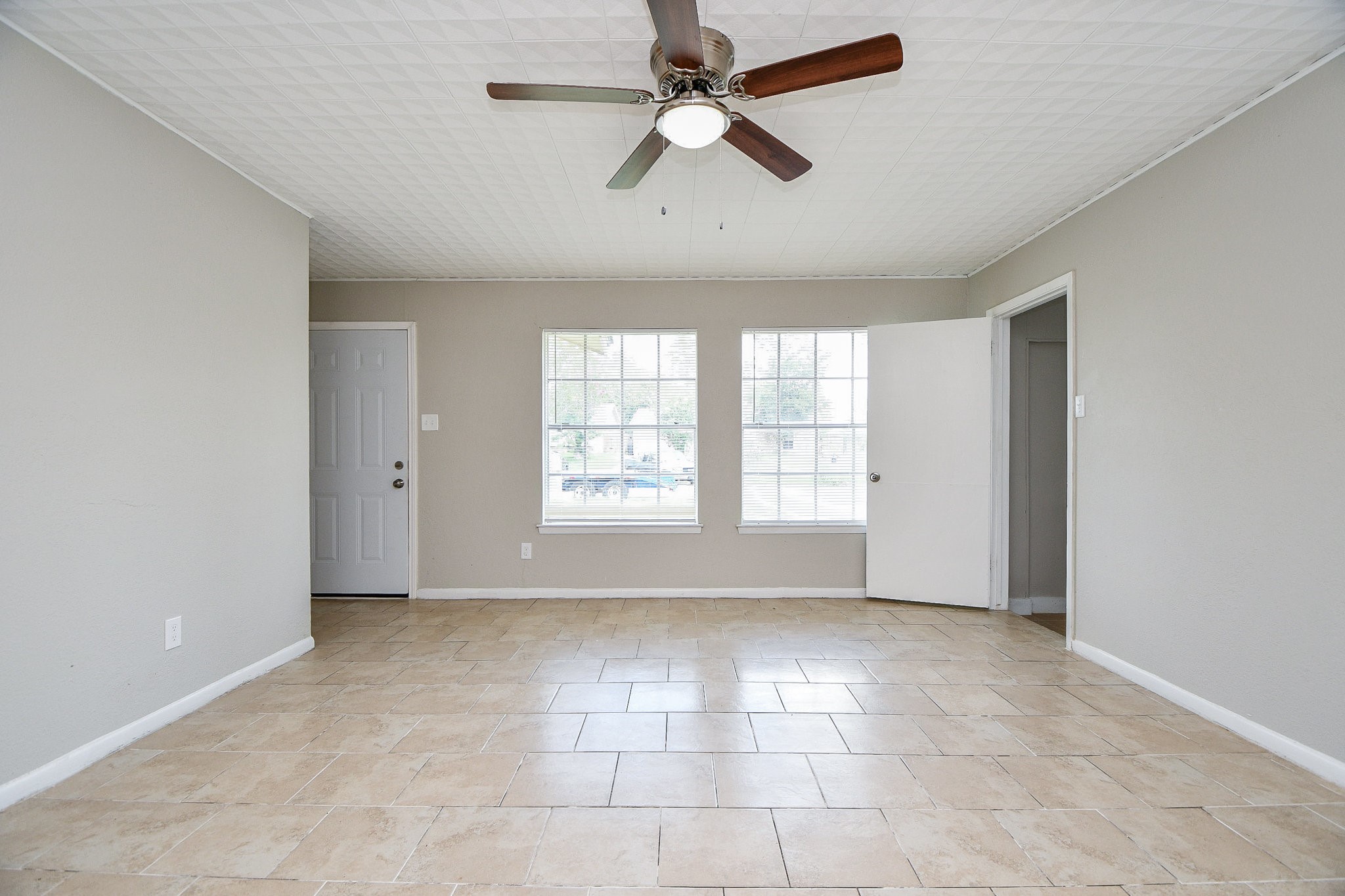 14902 Gloster Street Channelview, TX 77530 - Photo 8 of 21 a view of an empty room with a window
